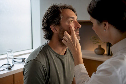 Clinician checking patient for visible jaundice