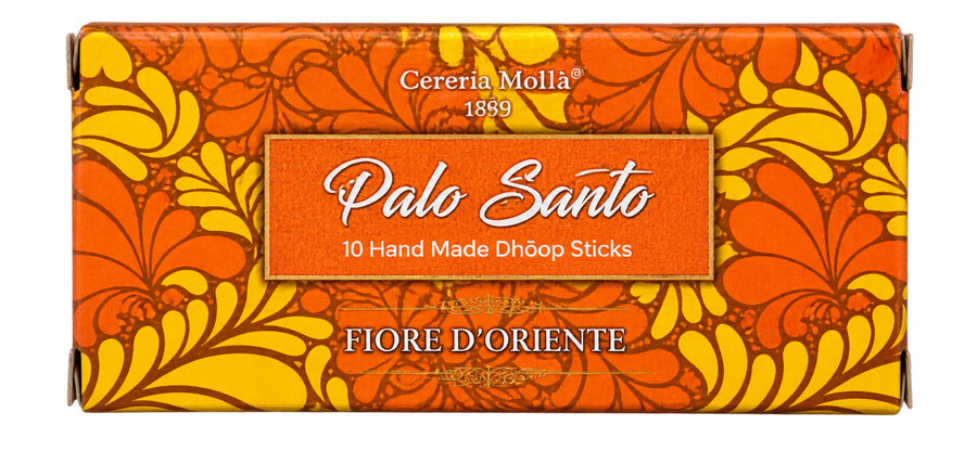 Cereria Molla Palo Santo incense stick box with a vibrant orange and yellow floral pattern, featuring the text 'Palo Santo' and '10 Hand Made Dhoom Sticks'.